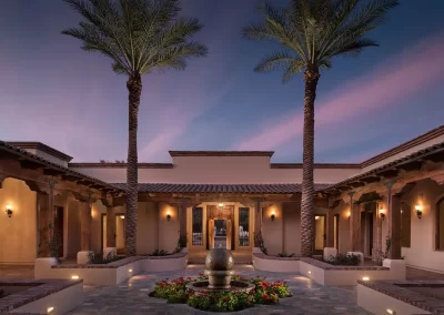 Garden Oasis in the Desert courtyard with fountain and palm trees