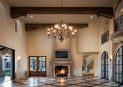 great room with chandelier and fireplace