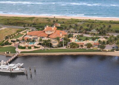 Palm Beach County Estate aerial view waterfront with dock and yacht
