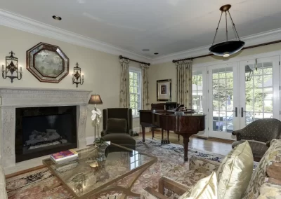 Howard County estate sitting room with fireplace and piano