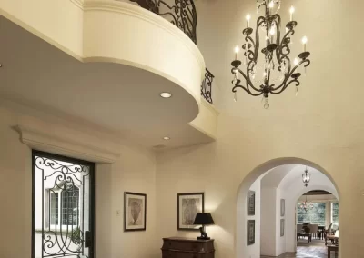 French Country Equestrian Estate foyer with mezzanine and chandelier
