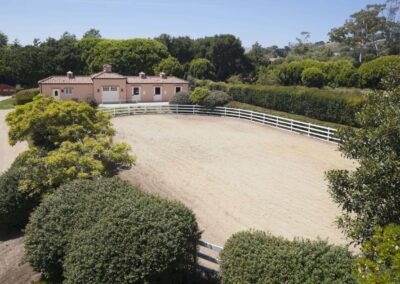 Equestrian facility including 3-stall barn, run-ins, feed room, groomsman's apartment and large riding ring