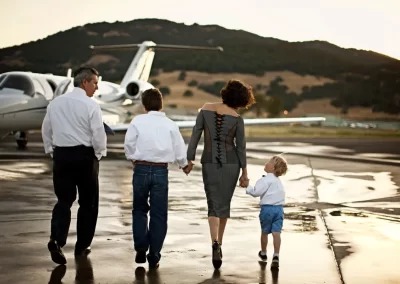 family boarding a private jet