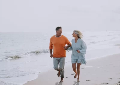couple jogging on the beach