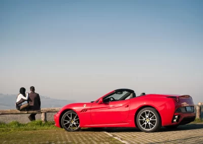 sports car parked at a scenic outlook